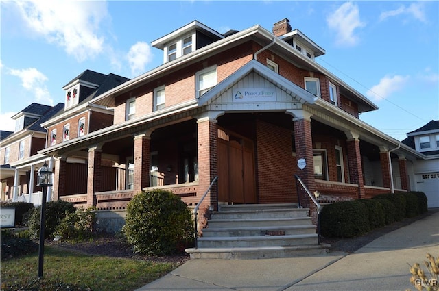 view of front of house featuring covered porch and brick siding