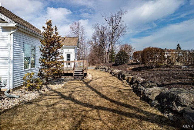 view of yard with a deck