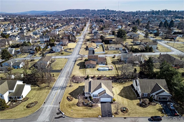 birds eye view of property with a residential view