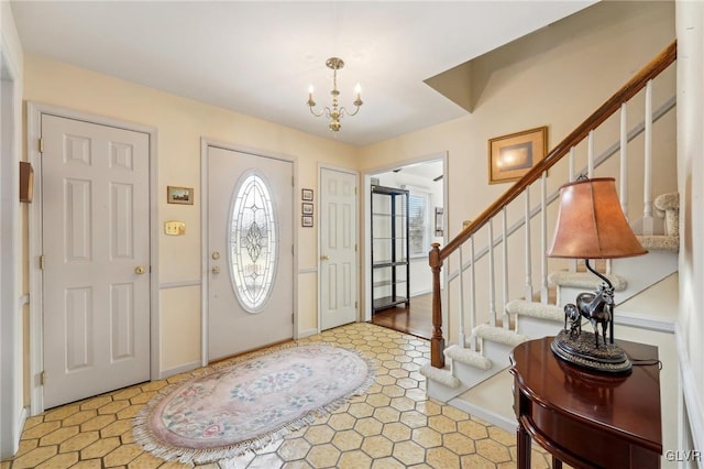 entrance foyer featuring an inviting chandelier and stairs