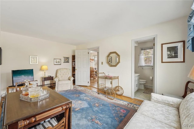 living area featuring wood finished floors and baseboards