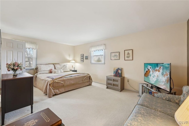 bedroom with light colored carpet