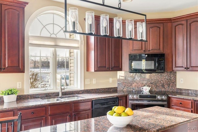 kitchen with black appliances, a sink, dark stone countertops, reddish brown cabinets, and decorative backsplash