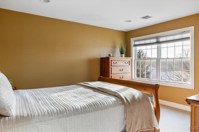 bedroom featuring visible vents, baseboards, and carpet floors