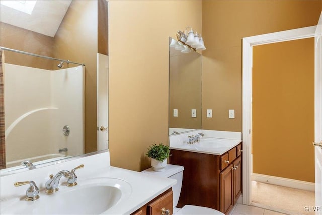 bathroom with shower / washtub combination, toilet, a skylight, tile patterned floors, and vanity