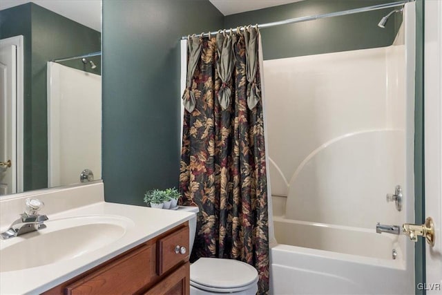 bathroom with vanity, shower / bath combination with curtain, and toilet