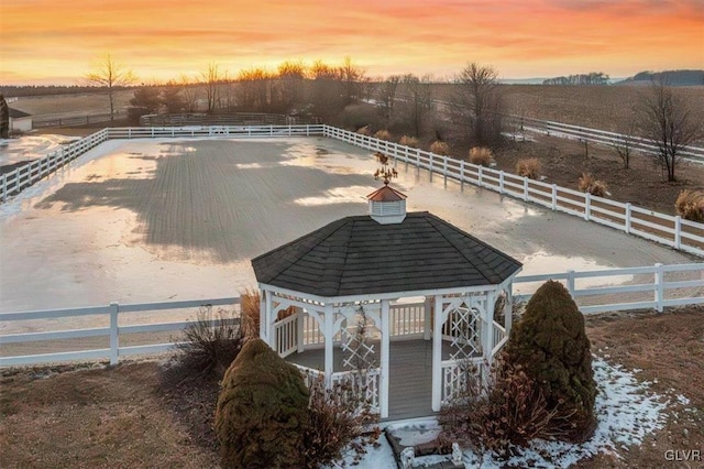 view of pool featuring a gazebo, a rural view, and an enclosed area