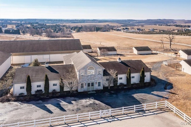 birds eye view of property with a rural view