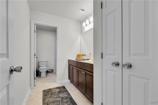 full bath featuring visible vents, toilet, tile patterned floors, vanity, and a closet