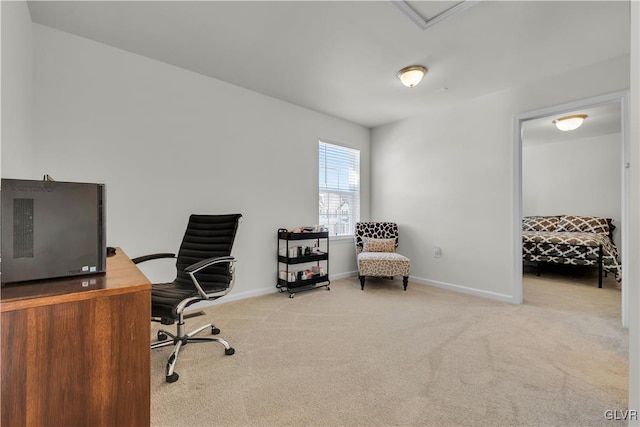 home office featuring light colored carpet and baseboards