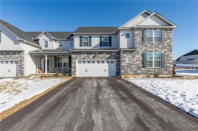 view of front of house featuring a garage and aphalt driveway