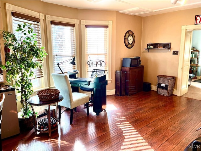 dining room featuring dark wood-style floors and baseboards