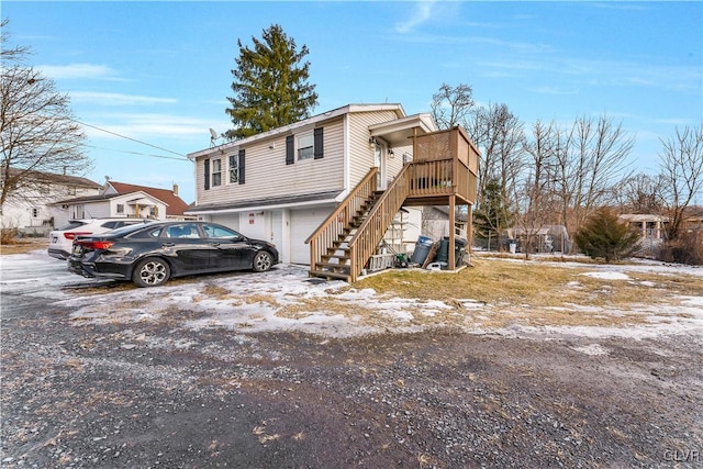 63 N 10th St, Stroudsburg, PA 18360 - view of front of property featuring a garage and stairs