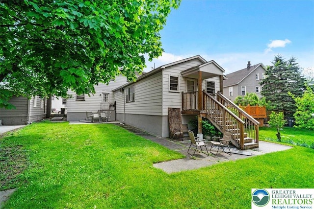 63 N 10th St, Stroudsburg, PA 18360 - view of front of house with a front yard and a patio