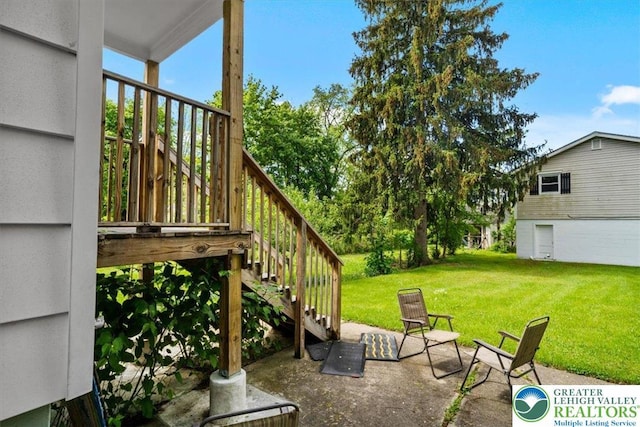 63 N 10th St, Stroudsburg, PA 18360 - view of green lawn featuring stairs and a patio area