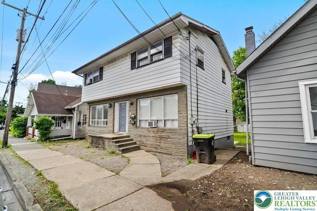 63 N 10th St, Stroudsburg, PA 18360 - view of front of house featuring a chimney