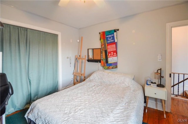 bedroom featuring ceiling fan and wood finished floors