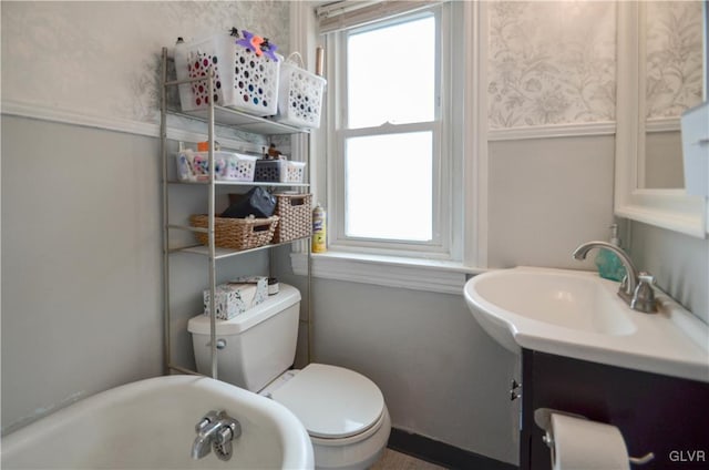 bathroom with toilet and a sink