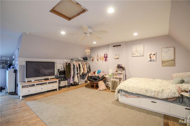 bedroom featuring light wood-style flooring, attic access, vaulted ceiling, and recessed lighting