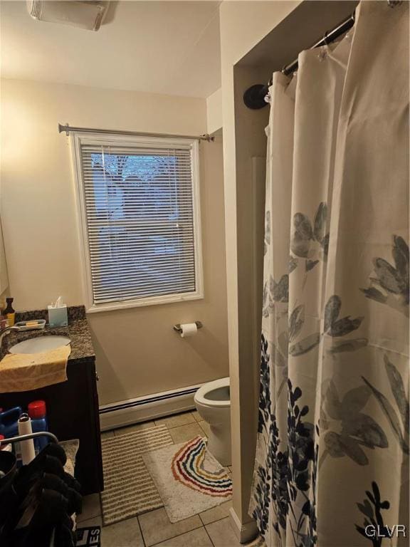 full bath featuring a baseboard radiator, toilet, a shower with shower curtain, vanity, and tile patterned floors