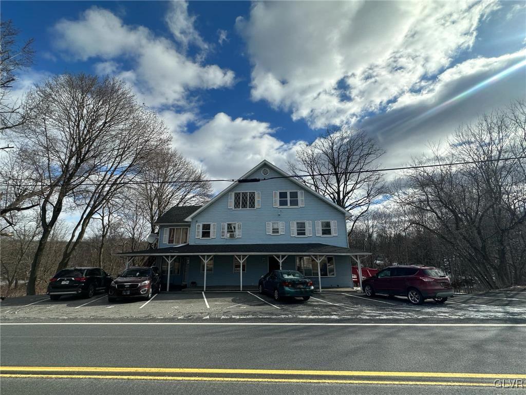 view of front of property with uncovered parking