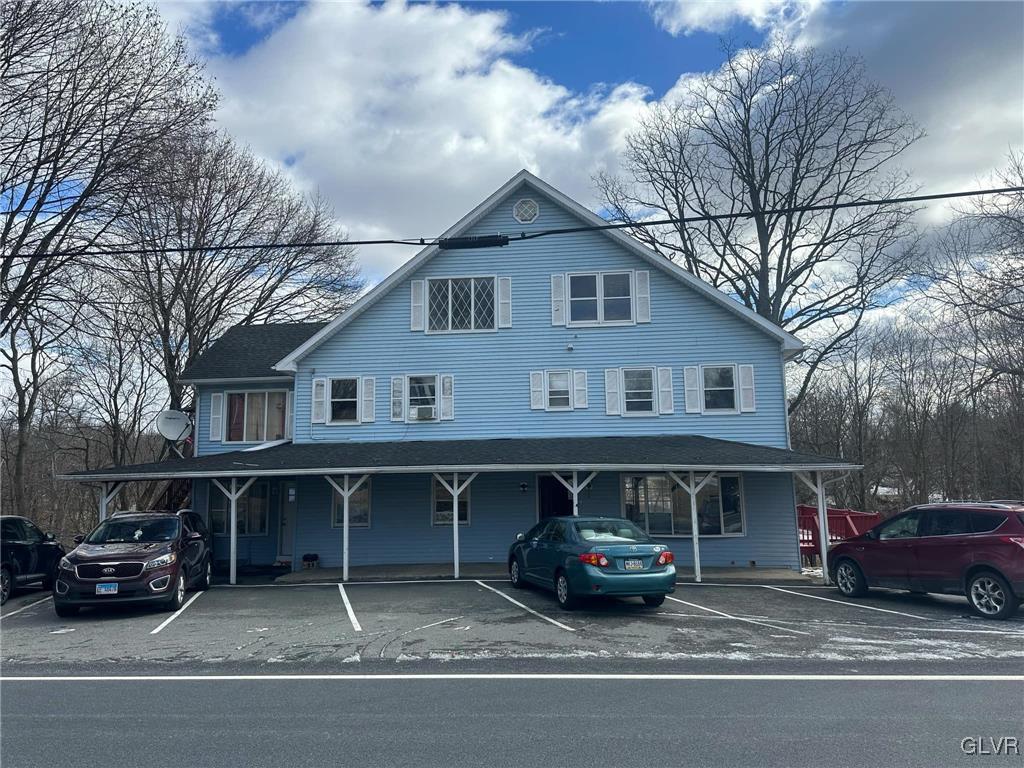 view of front of house featuring uncovered parking