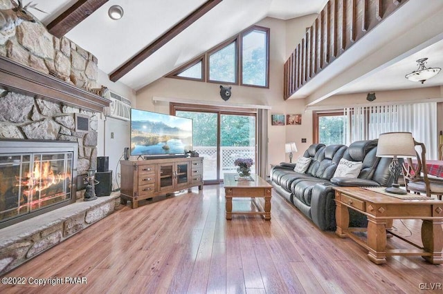 134 Moseywood Rd, Kidder Township S, PA 18624 - living room featuring a healthy amount of sunlight, a fireplace, beam ceiling, and hardwood / wood-style floors
