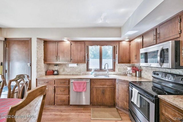 134 Moseywood Rd, Kidder Township S, PA 18624 - kitchen with a sink, light countertops, decorative backsplash, and appliances with stainless steel finishes