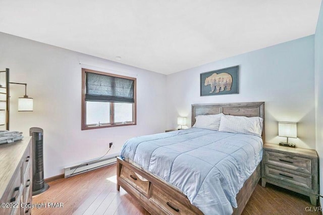 134 Moseywood Rd, Kidder Township S, PA 18624 - bedroom with baseboards, a baseboard heating unit, and wood finished floors