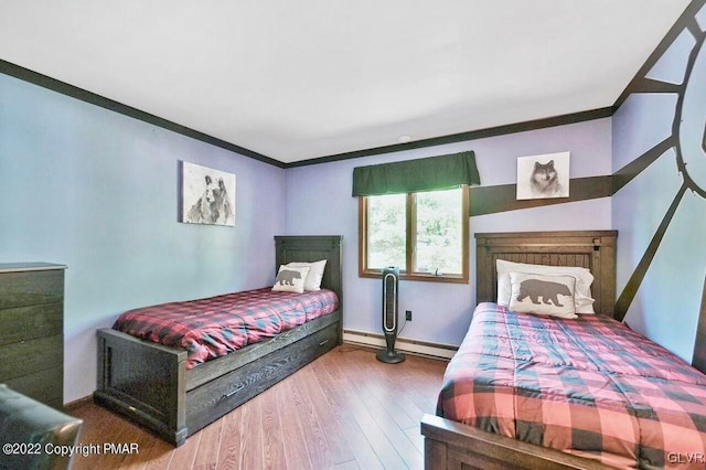 134 Moseywood Rd, Kidder Township S, PA 18624 - bedroom with baseboards, ornamental molding, wood finished floors, and a baseboard heating unit