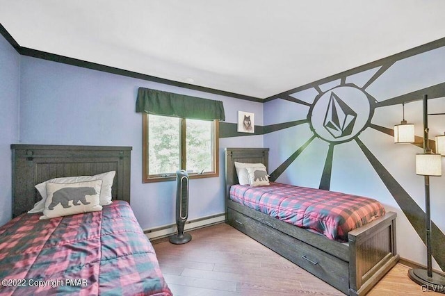 134 Moseywood Rd, Kidder Township S, PA 18624 - bedroom featuring baseboards, wood finished floors, crown molding, and a baseboard radiator
