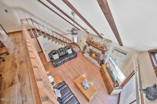 134 Moseywood Rd, Kidder Township S, PA 18624 - unfurnished living room with a stone fireplace, stairs, visible vents, and wood finished floors