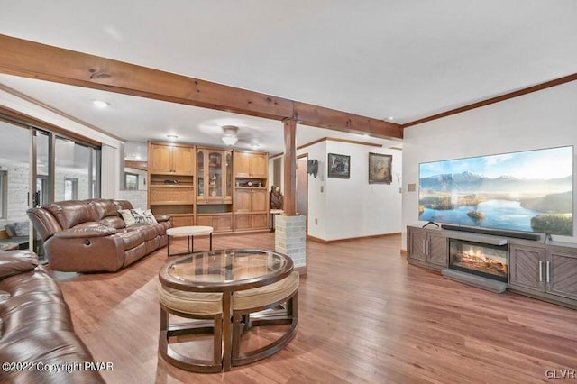 134 Moseywood Rd, Kidder Township S, PA 18624 - living area with baseboards, light wood-style flooring, crown molding, and beam ceiling
