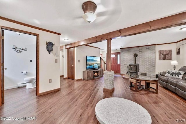134 Moseywood Rd, Kidder Township S, PA 18624 - living room featuring a baseboard radiator, wood finished floors, and a wood stove