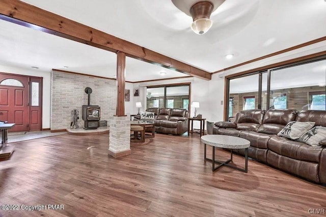 134 Moseywood Rd, Kidder Township S, PA 18624 - living room with a wealth of natural light, wood finished floors, a wood stove, and beamed ceiling