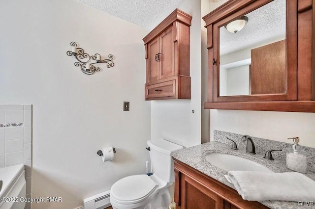 134 Moseywood Rd, Kidder Township S, PA 18624 - full bathroom with a textured ceiling, a bathing tub, a baseboard radiator, toilet, and vanity