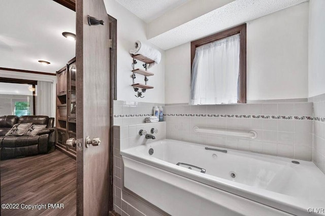 134 Moseywood Rd, Kidder Township S, PA 18624 - bathroom featuring a tub with jets and wood finished floors