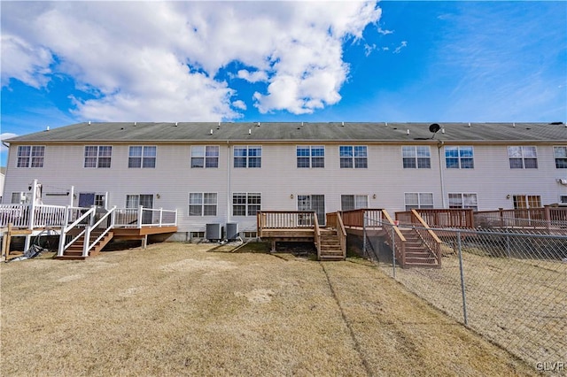 back of house featuring a deck, fence, central AC unit, and stairs