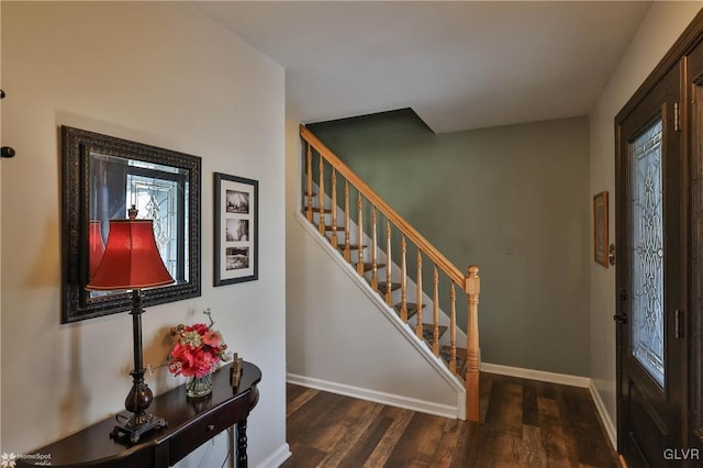 entrance foyer with stairs, baseboards, and wood finished floors