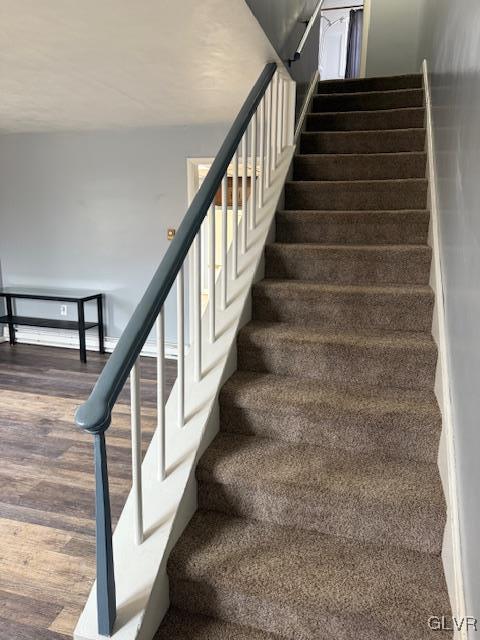 stairs with wood finished floors