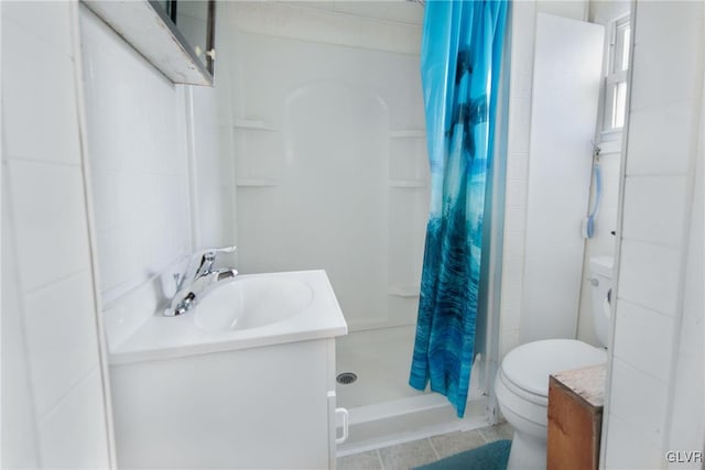 full bathroom with toilet, a shower stall, and vanity