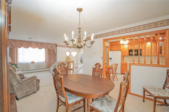 dining space with light carpet, baseboard heating, and an inviting chandelier