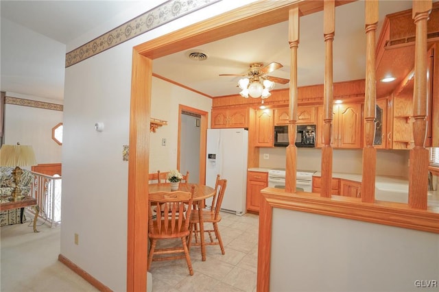 interior space with visible vents, a ceiling fan, ornamental molding, white appliances, and baseboards