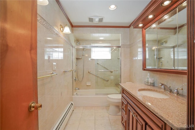 full bath featuring a baseboard radiator, vanity, visible vents, tile walls, and tile patterned floors