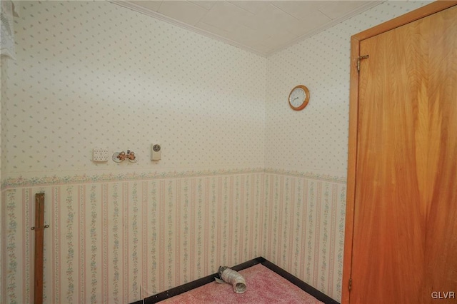 laundry area featuring wallpapered walls and ornamental molding