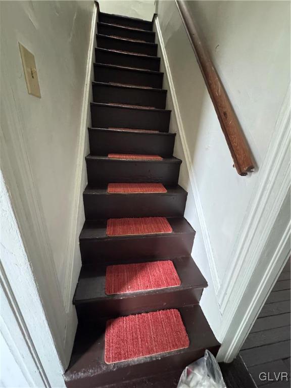 stairs with wood finished floors