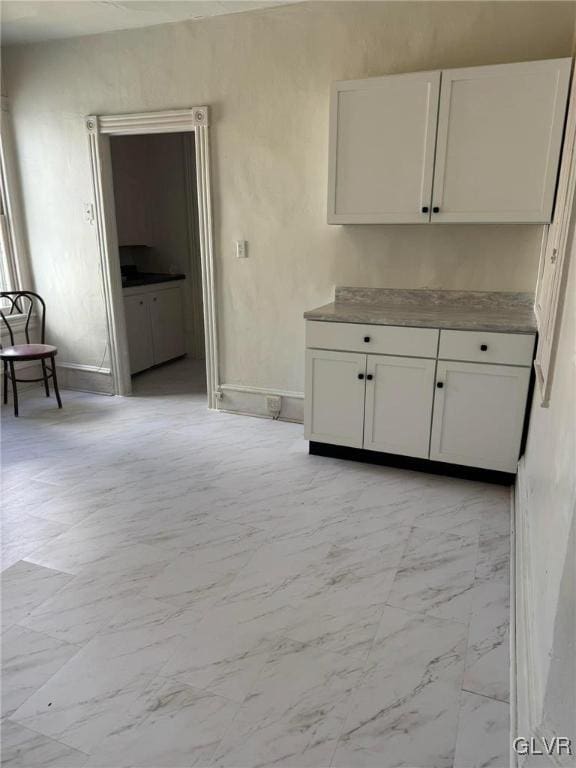 253 N 2nd, Lehighton Boro, PA 18235 - kitchen featuring light marble finish floors and white cabinets