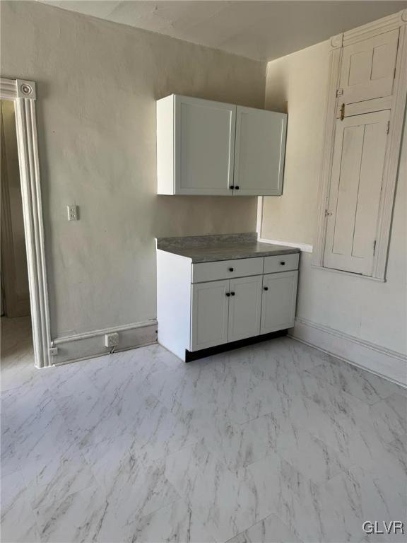 253 N 2nd, Lehighton Boro, PA 18235 - kitchen with light marble finish flooring and white cabinetry