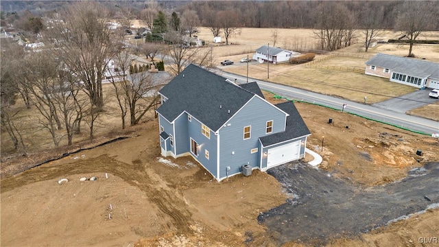 birds eye view of property featuring a rural view