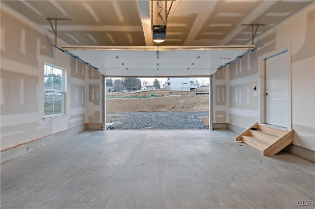 garage featuring baseboards and a garage door opener